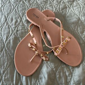 Steven nude plastic flip flops with gold stud accents. Barely worn.